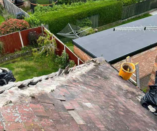 This is a photo of a roof hip that is having the hip (or bonnet) tiles replaced. Works carried out by ATY Roofing Mexborough