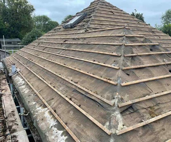 This is a photo of a hip roof that has been stripped back to the battens, and is awaiting a new roof covering to be installed. Works carried out by ATY Roofing Mexborough